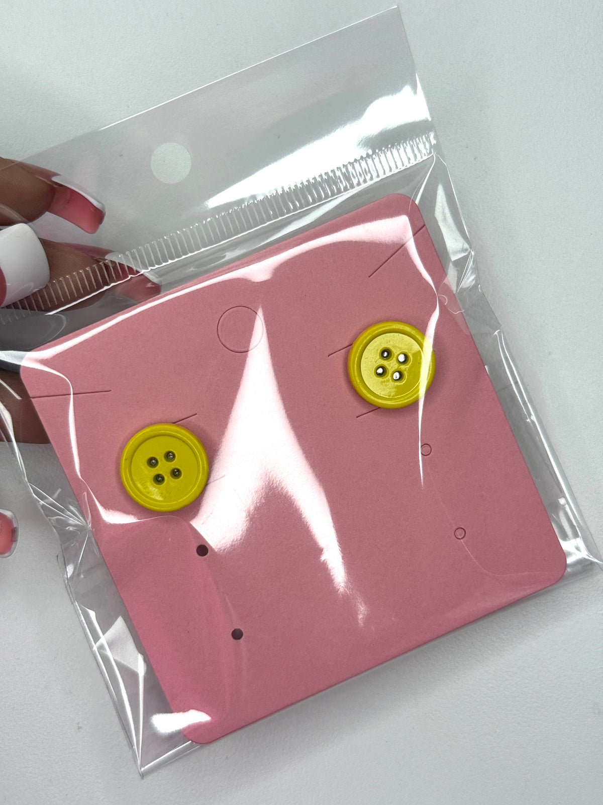 Yellow button earrings