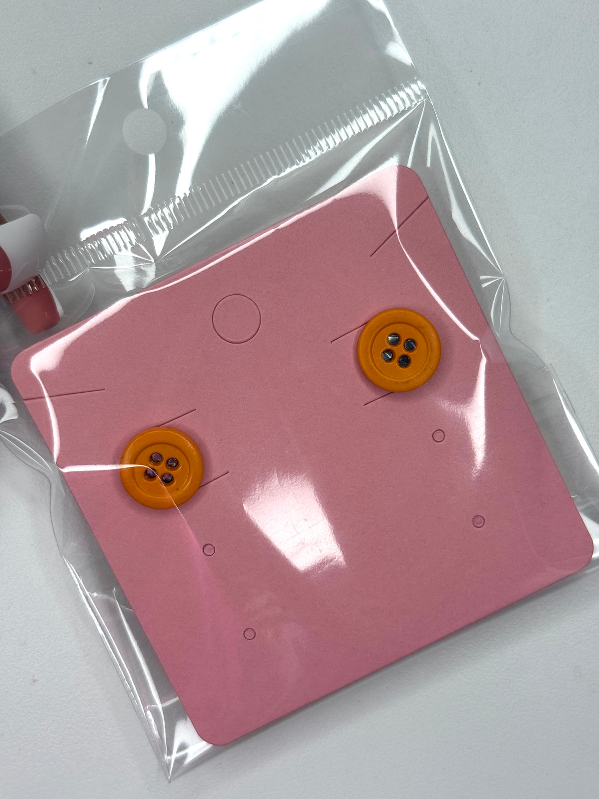 Tangerine button earrings