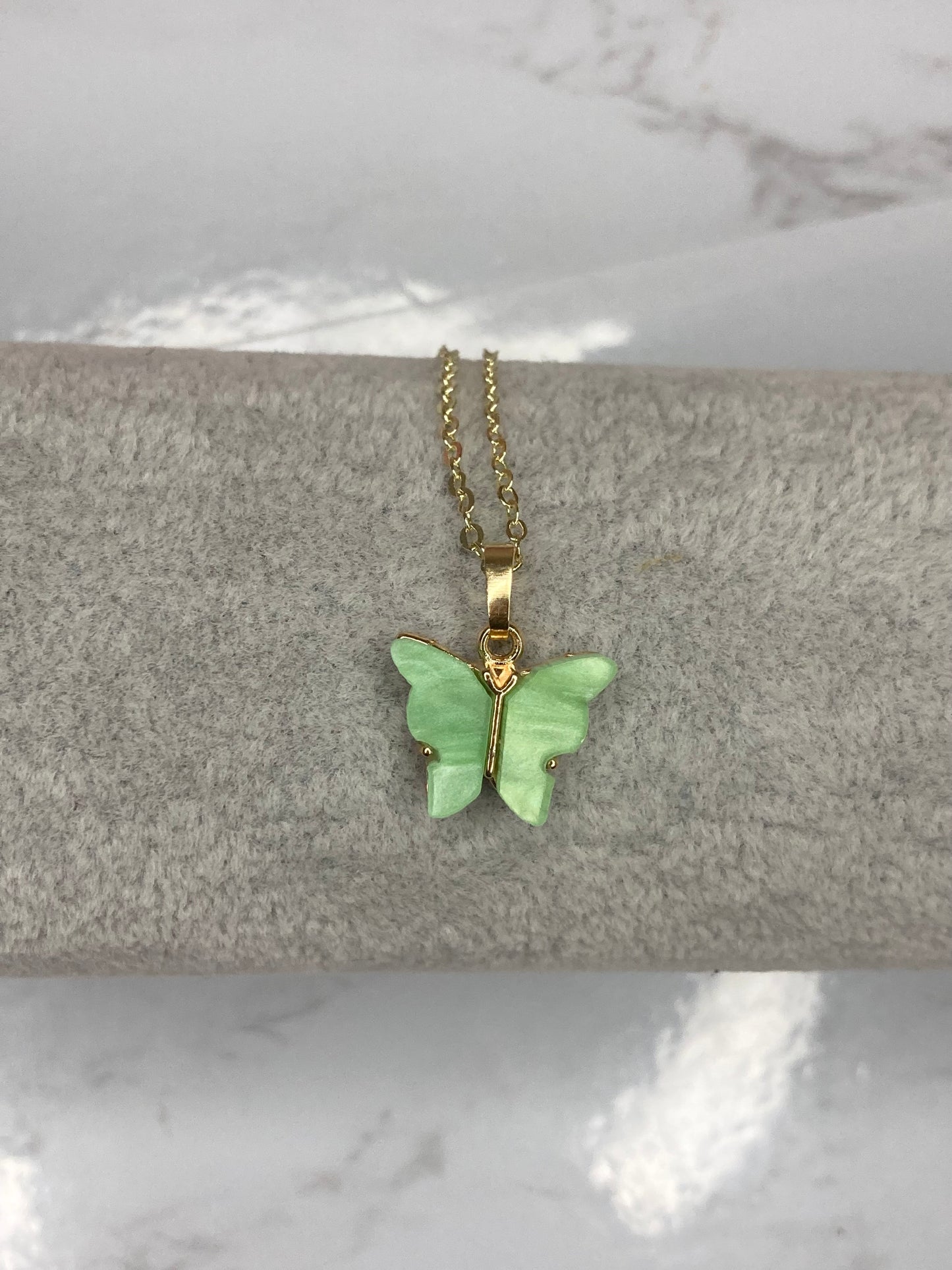 Green fluttering butterfly necklace