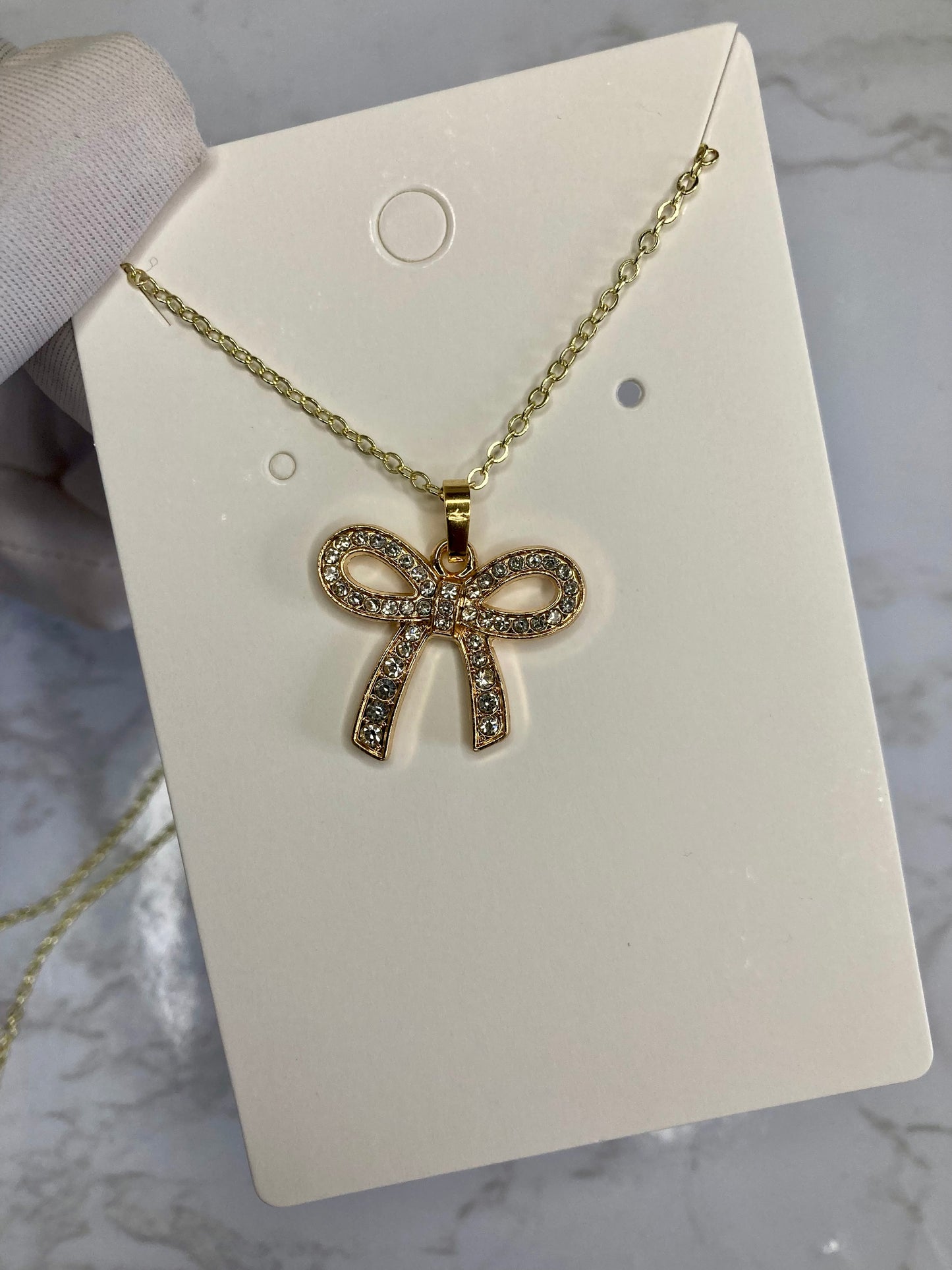 Gold bow necklace