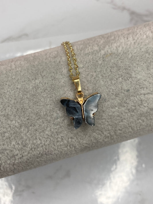 Black fluttering butterfly necklace