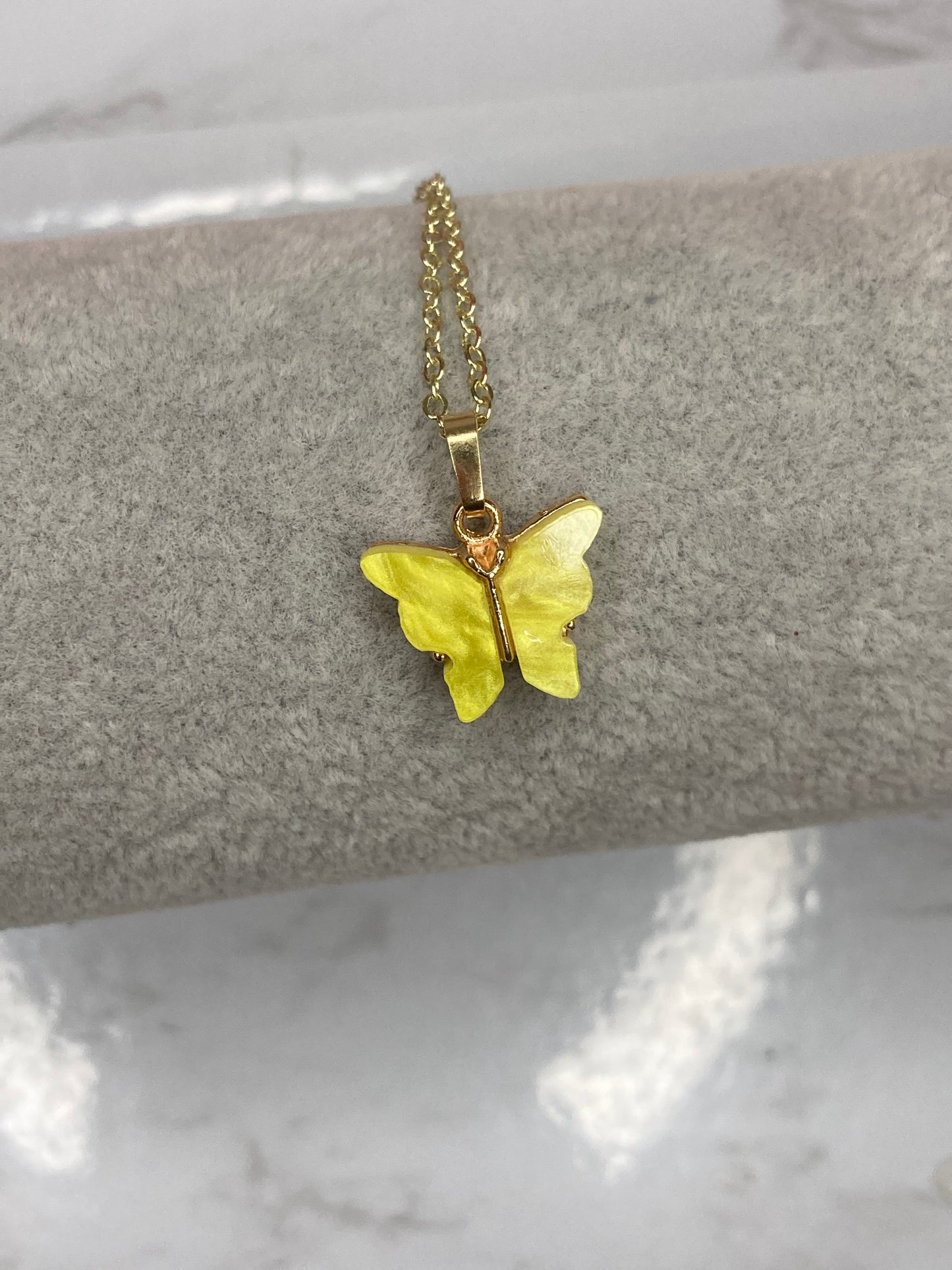 Yellow fluttering butterfly necklace